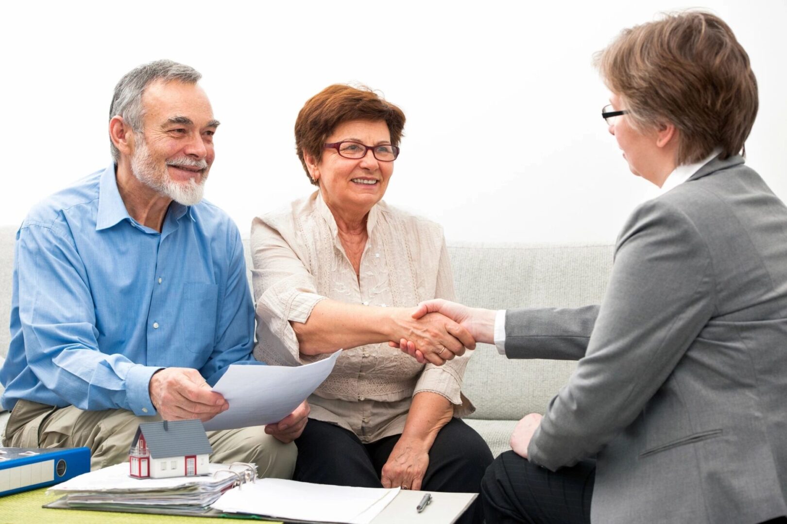 Seniors couple meeting with financial adviser